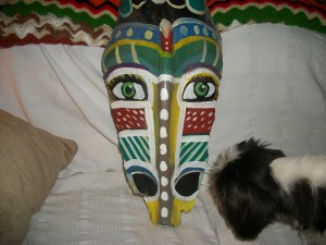 tribal mask on recycled palm bark
